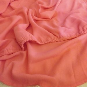 Sleeveless Hi-Lo draping shirt